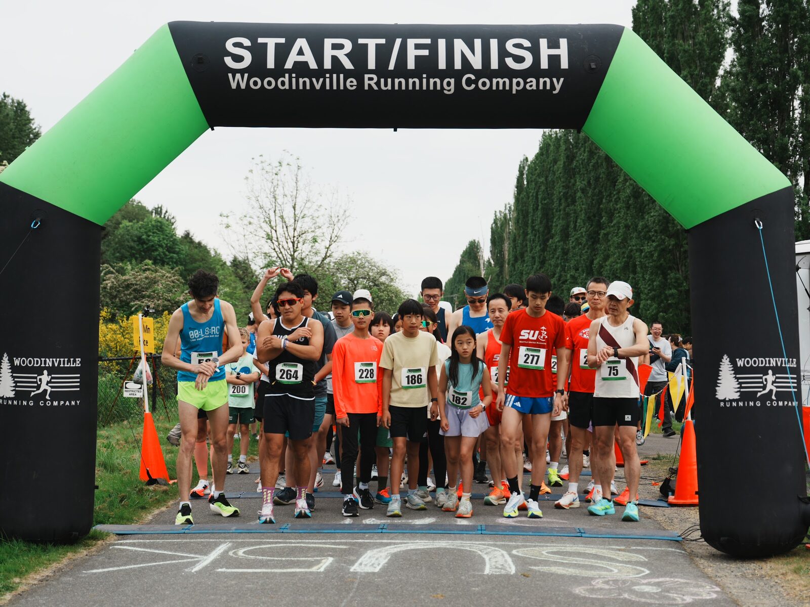 Runners gathered under the start and finish arch at the 2026 Seattle United 5K