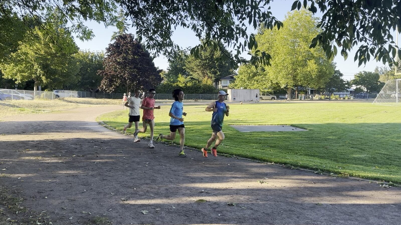 Runners on the path around the field